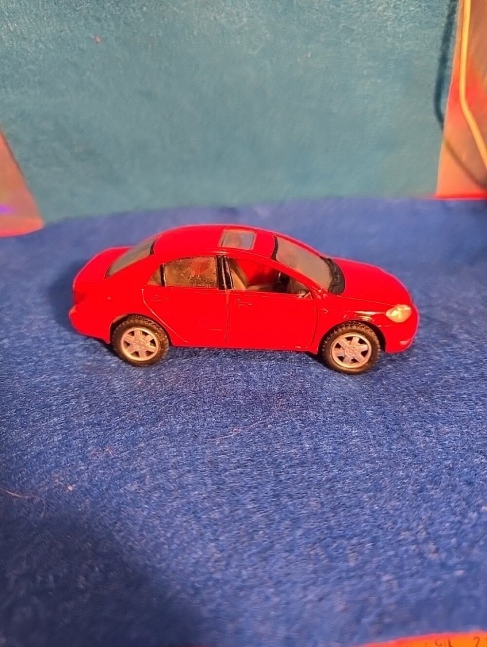 051926  a red Kinsmart 1/36 scale diecast Toyota Model Features: The toy featur